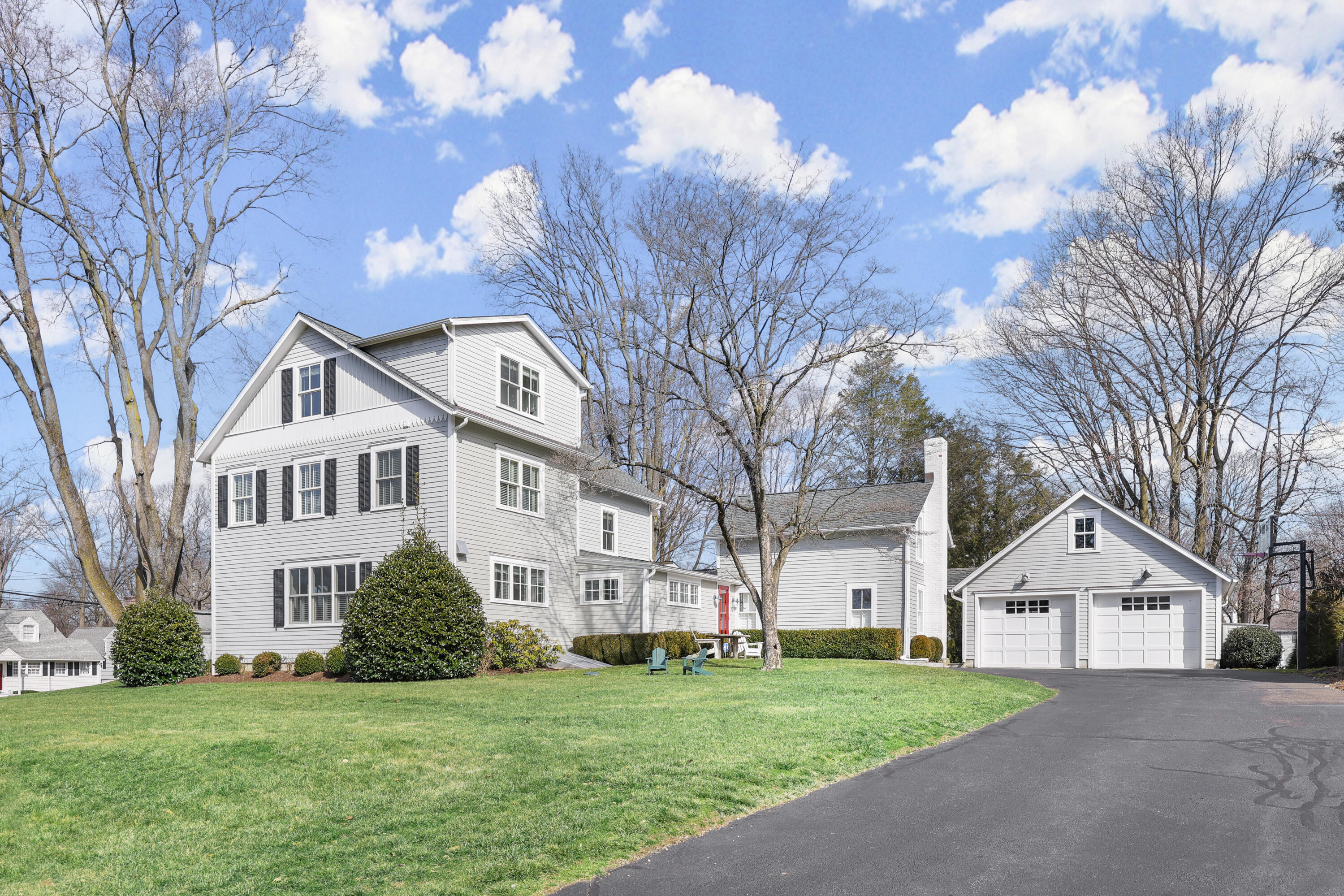 100 Hollow Tree Ridge Road Darien, CT 06820 - Photo 37 of 38 a front view of a house with a garden and trees