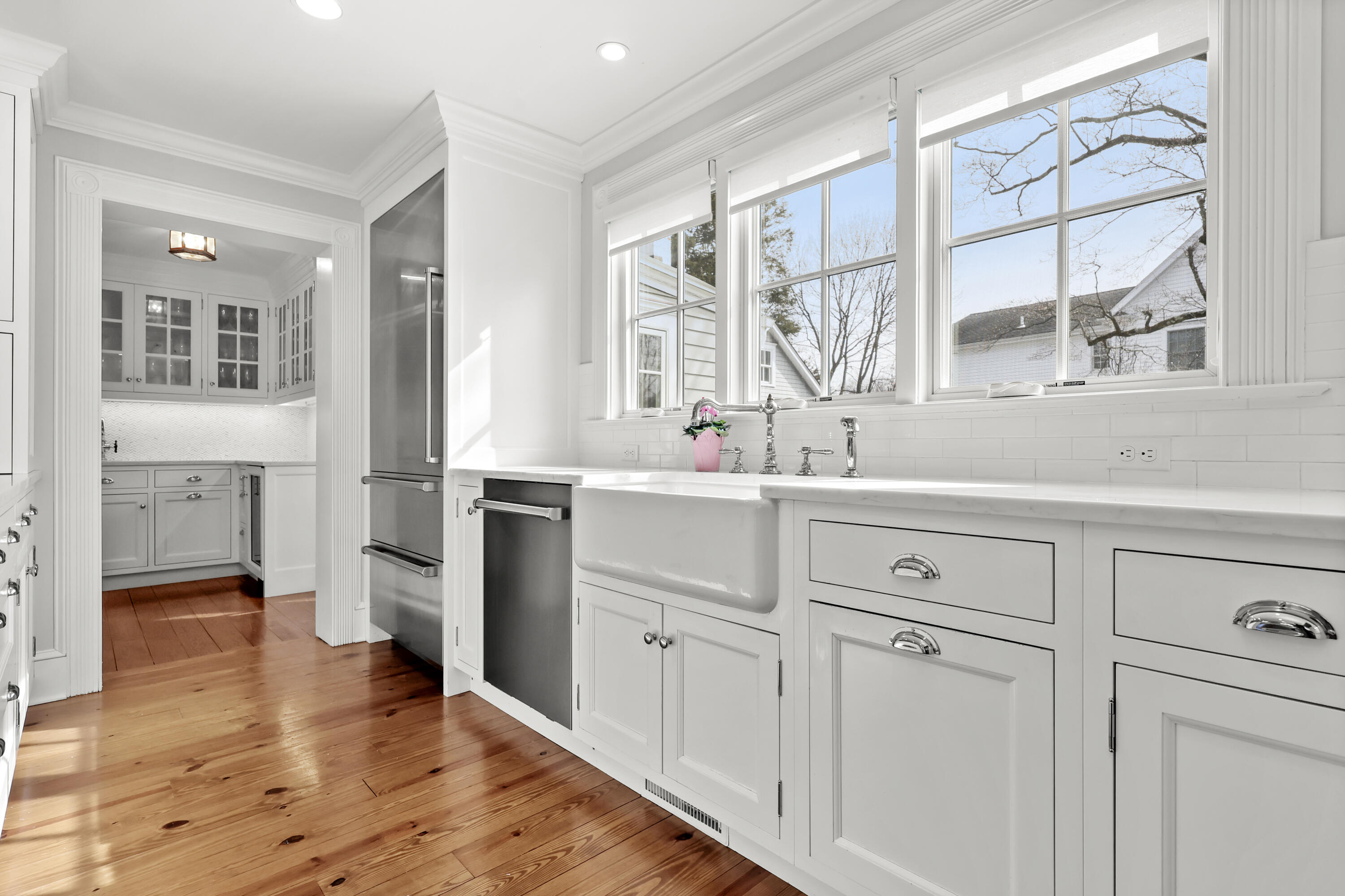 100 Hollow Tree Ridge Road Darien, CT 06820 - Photo 8 of 38 a kitchen with white cabinets and a window