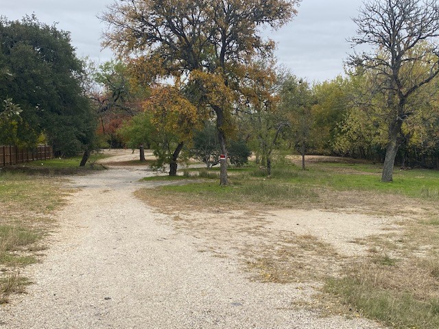 2807 Hunter Road San Marcos, TX 78666 - Photo 2 of 14 a backyard of a house with lots of green space
