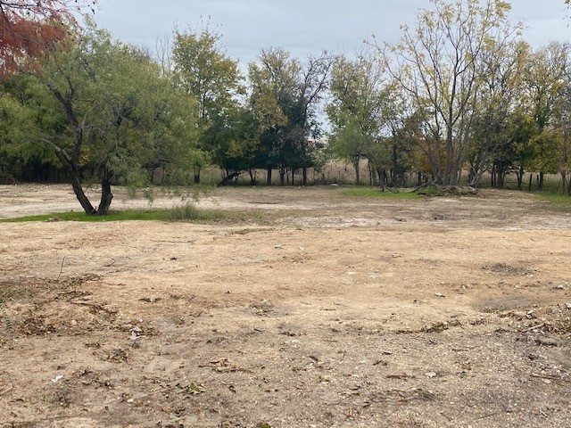 2807 Hunter Road San Marcos, TX 78666 - Photo 3 of 14 a view of dirt field with trees in the background
