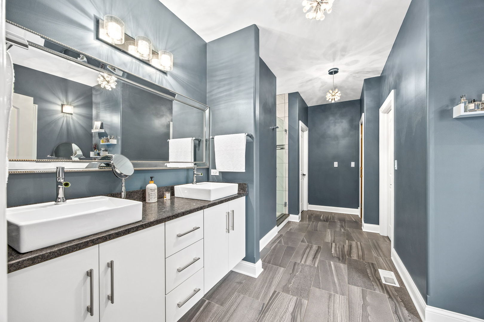 12549 Old Farm Road Manhattan, IL 60442 - Photo 14 of 66 a spacious bathroom with a double vanity sink and a mirror