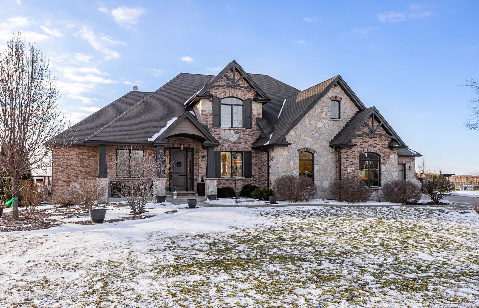 12549 Old Farm Road Manhattan, IL 60442 - Photo 2 of 66 a front view of a house with a yard