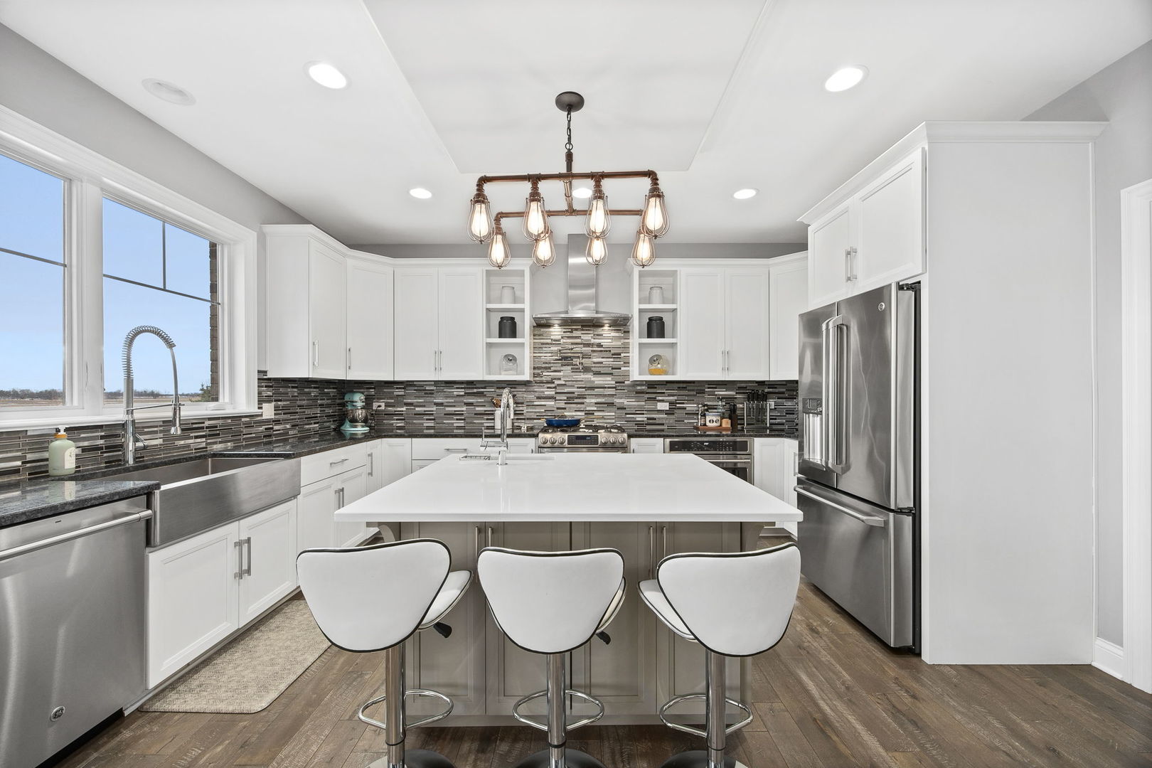 12549 Old Farm Road Manhattan, IL 60442 - Photo 24 of 66 a large kitchen with a table and chairs