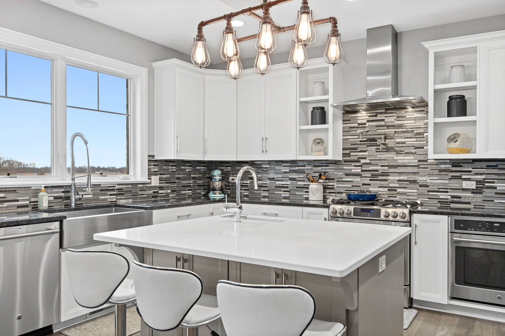 12549 Old Farm Road Manhattan, IL 60442 - Photo 25 of 66 a kitchen with a sink a stove and chairs