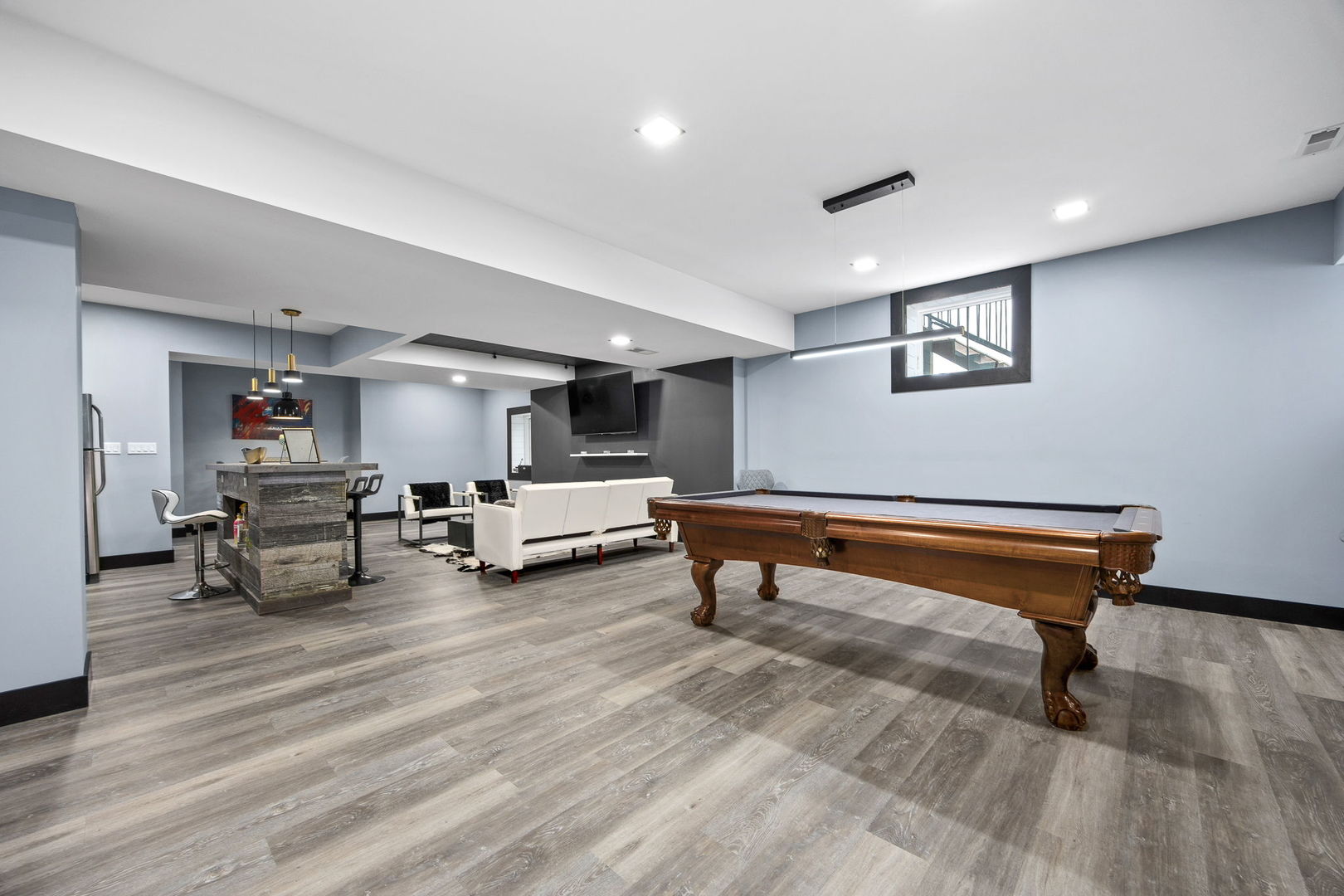 12549 Old Farm Road Manhattan, IL 60442 - Photo 32 of 66 a room with lots of furniture and wooden floor