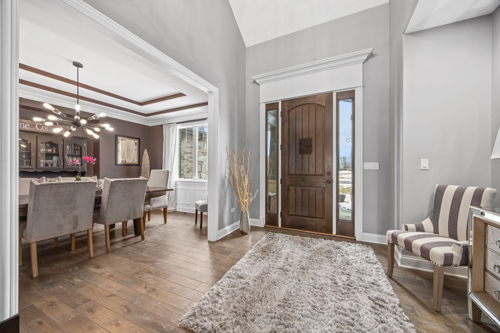 12549 Old Farm Road Manhattan, IL 60442 - Photo 37 of 66 a living room with furniture and a dining table next to a window