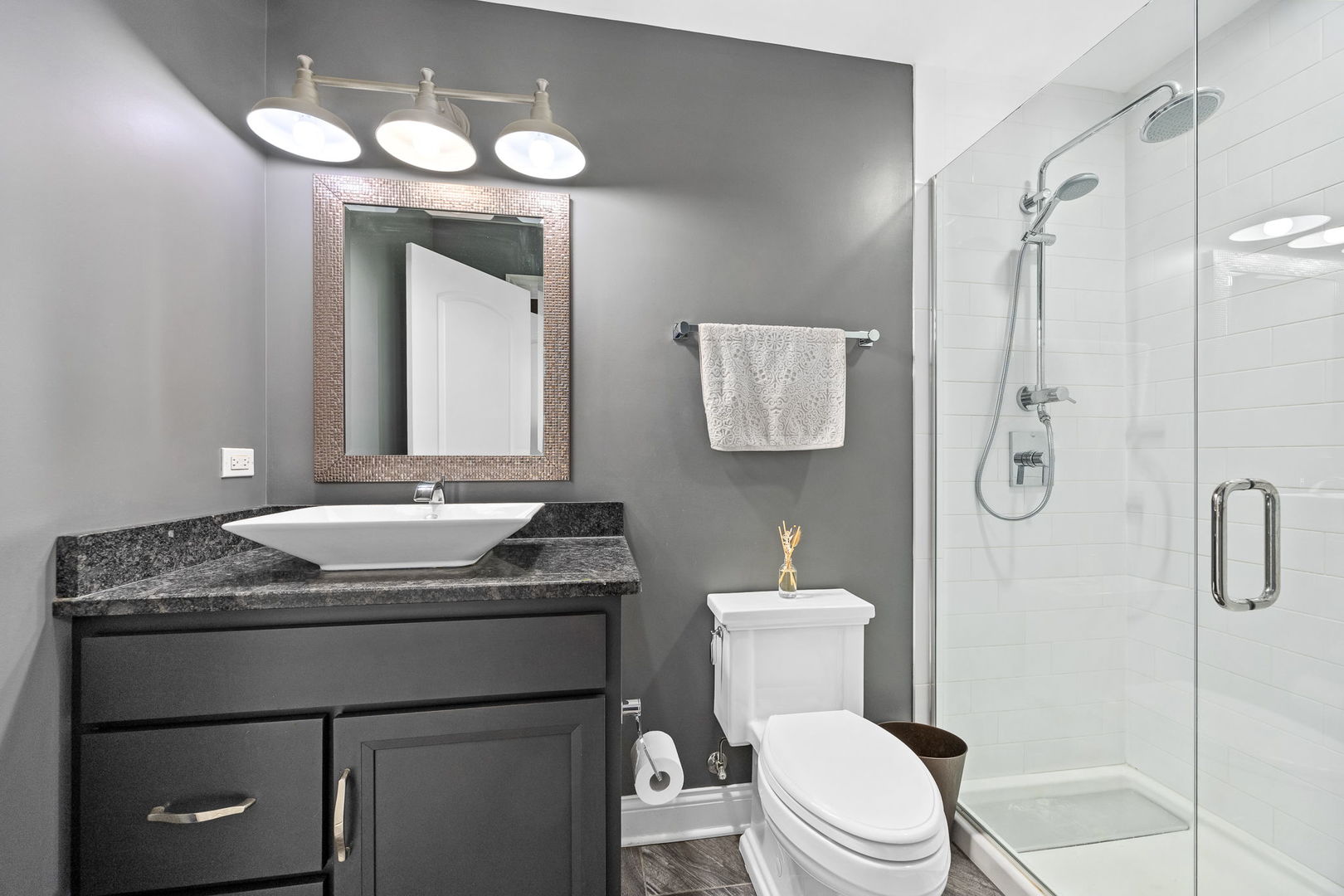 12549 Old Farm Road Manhattan, IL 60442 - Photo 44 of 66 a bathroom with a granite countertop sink toilet a mirror a vanity and shower