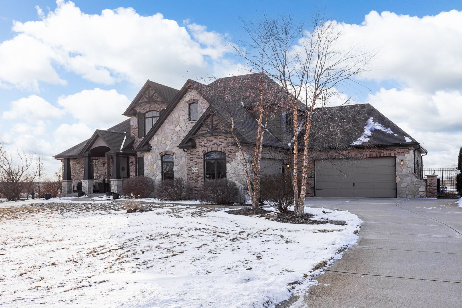 12549 Old Farm Road Manhattan, IL 60442 - Photo 5 of 66 a view of a house with a yard covered in snow