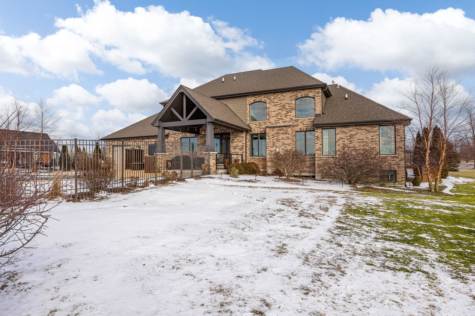 12549 Old Farm Road Manhattan, IL 60442 - Photo 54 of 66 a front view of a house with a yard and garage