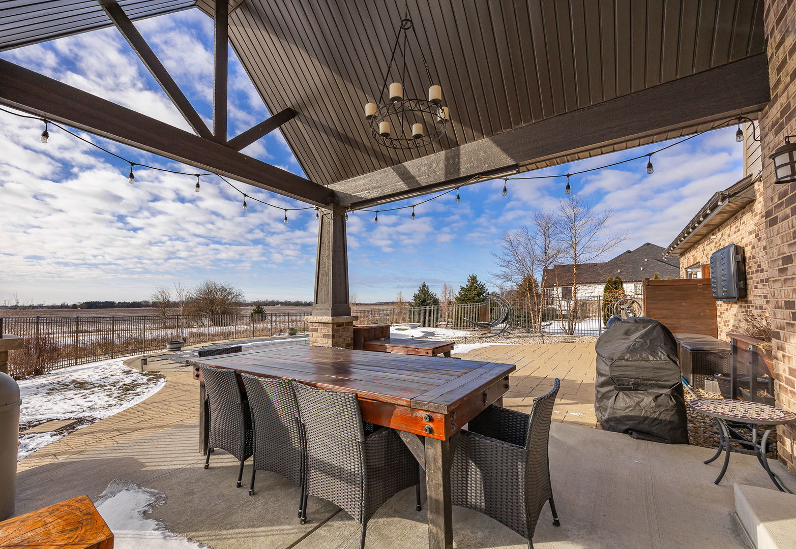 12549 Old Farm Road Manhattan, IL 60442 - Photo 57 of 66 a view of a patio with a table and chairs
