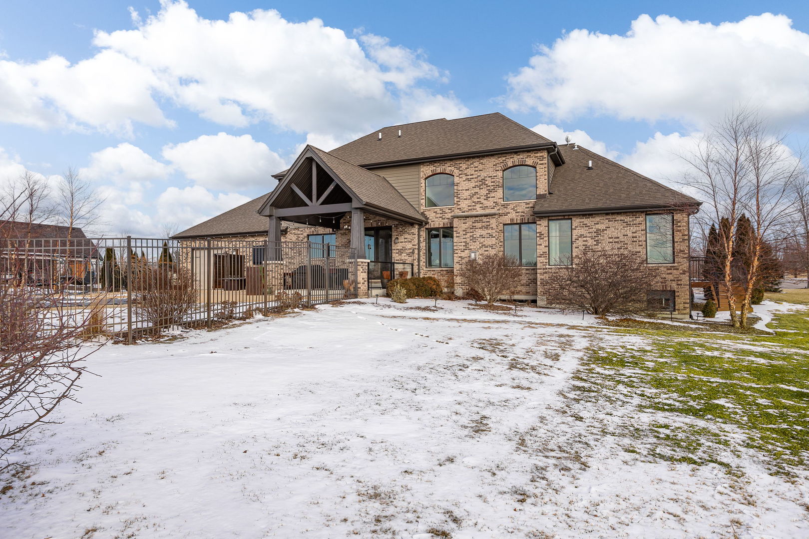 12549 Old Farm Road Manhattan, IL 60442 - Photo 64 of 66 a front view of a house with a yard and garage