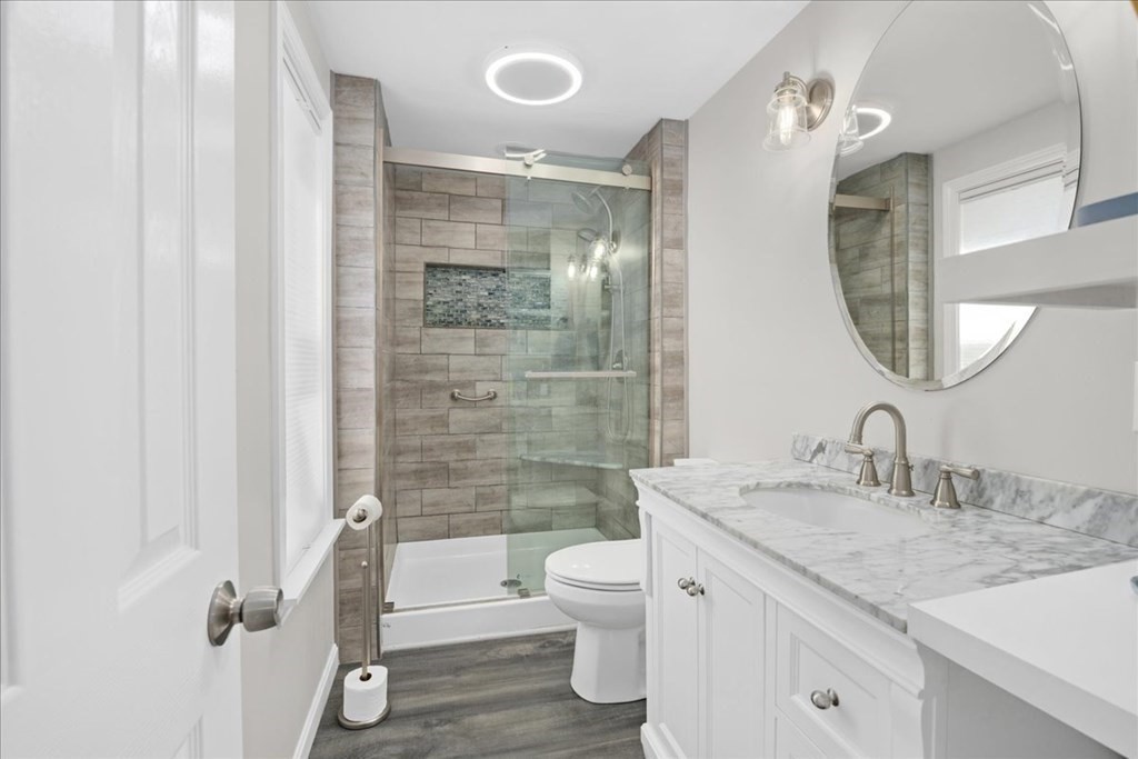 11 Merrill Road Sutton, MA 01590 - Photo 17 of 42 a bathroom with a granite countertop sink toilet and shower