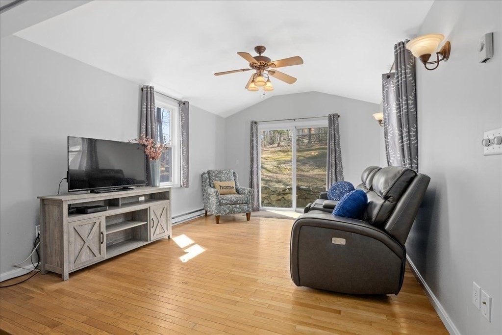11 Merrill Road Sutton, MA 01590 - Photo 18 of 42 a living room with furniture and a flat screen tv