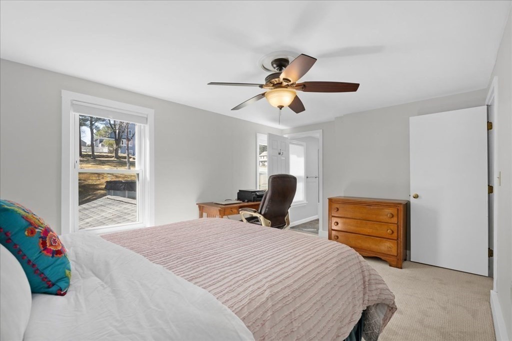 11 Merrill Road Sutton, MA 01590 - Photo 25 of 42 a bedroom with a bed a dresser and a window