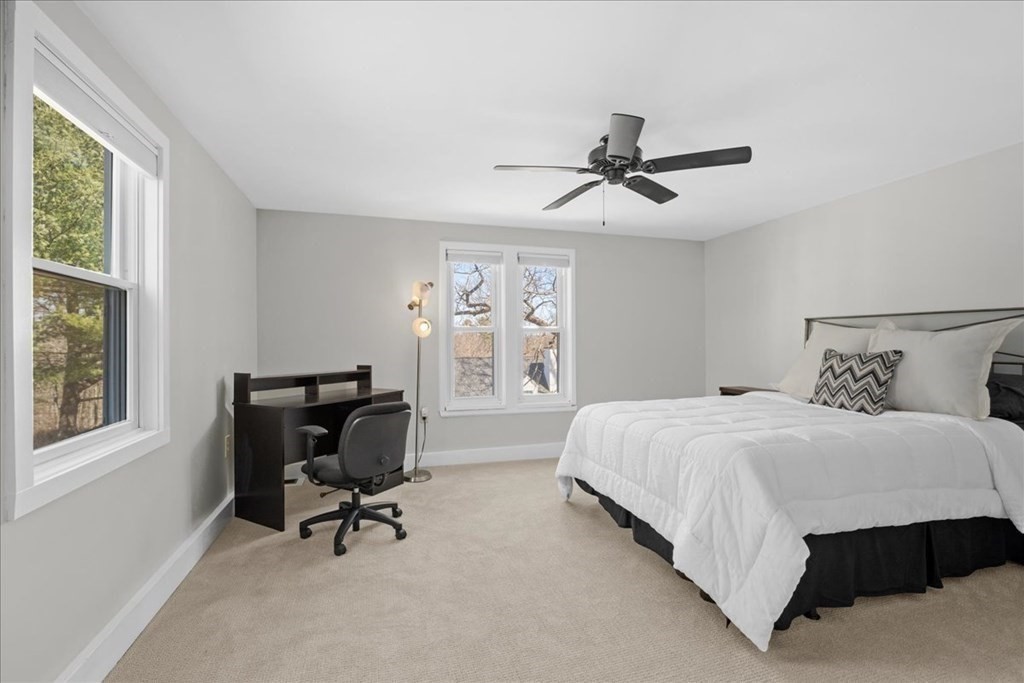 11 Merrill Road Sutton, MA 01590 - Photo 27 of 42 a bedroom with a bed a chair and a large window