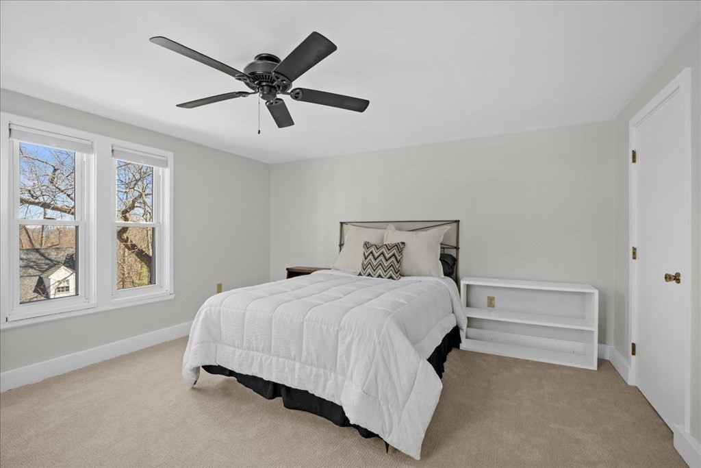 11 Merrill Road Sutton, MA 01590 - Photo 28 of 42 a bedroom with a bed and window