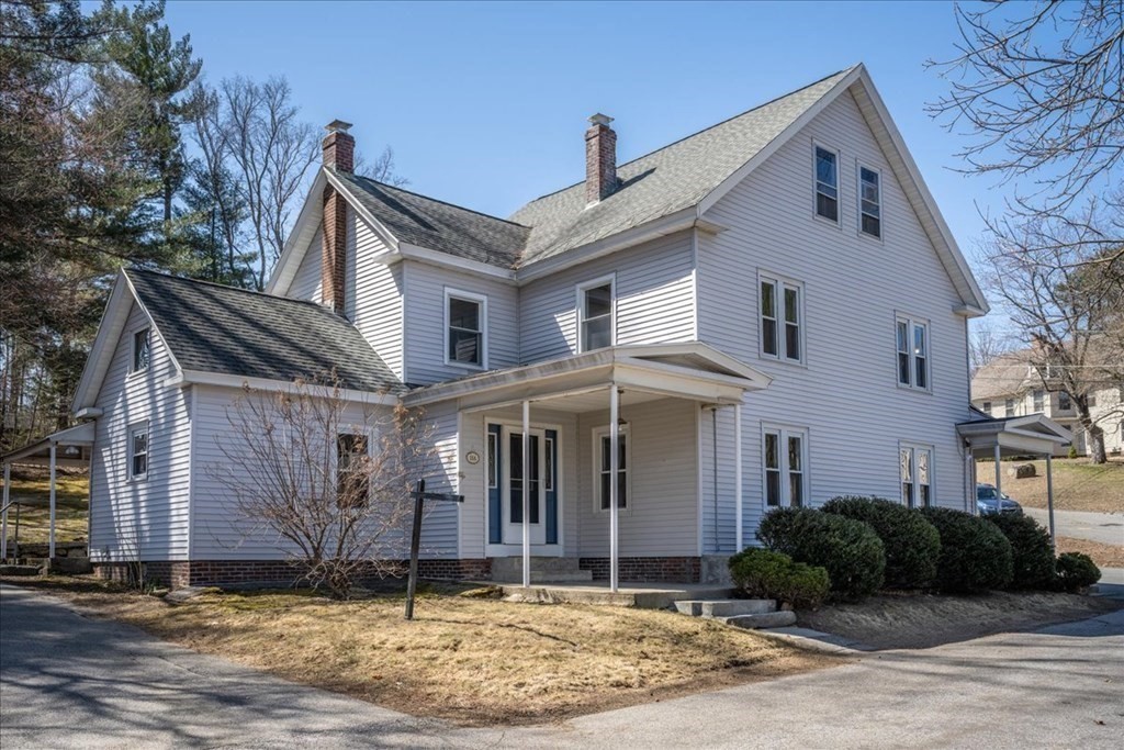 11 Merrill Road Sutton, MA 01590 - Photo 3 of 42 a front view of a house with a garden
