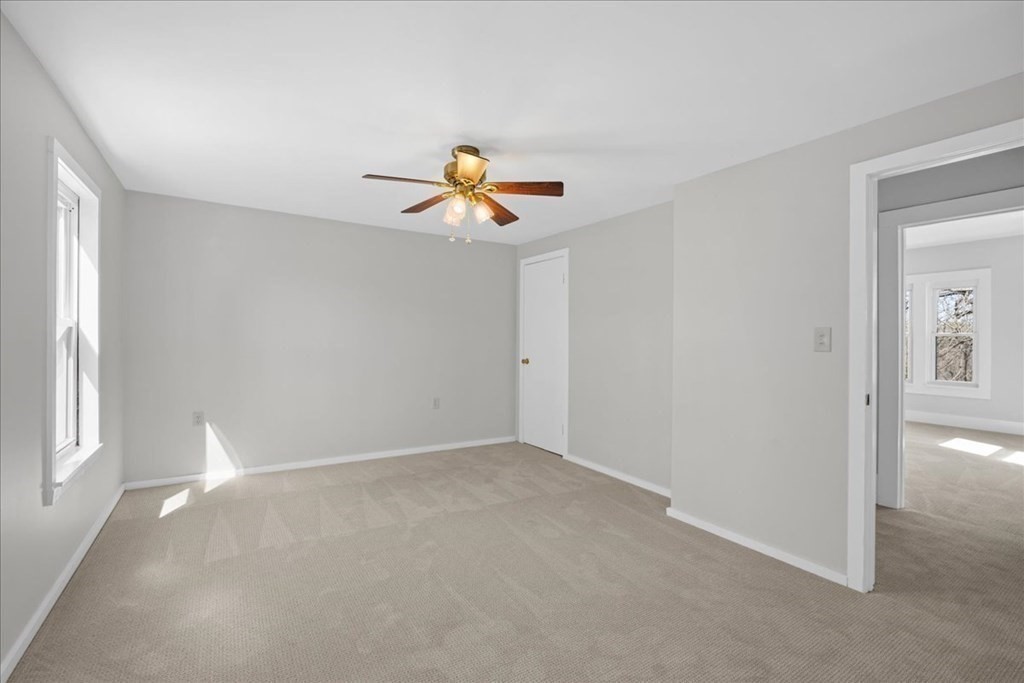 11 Merrill Road Sutton, MA 01590 - Photo 35 of 42 an empty room with window and ceiling fan
