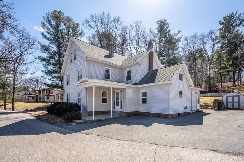 11 Merrill Road Sutton, MA 01590 - Photo 42 of 42 a view of a white house with a large tree in front of it