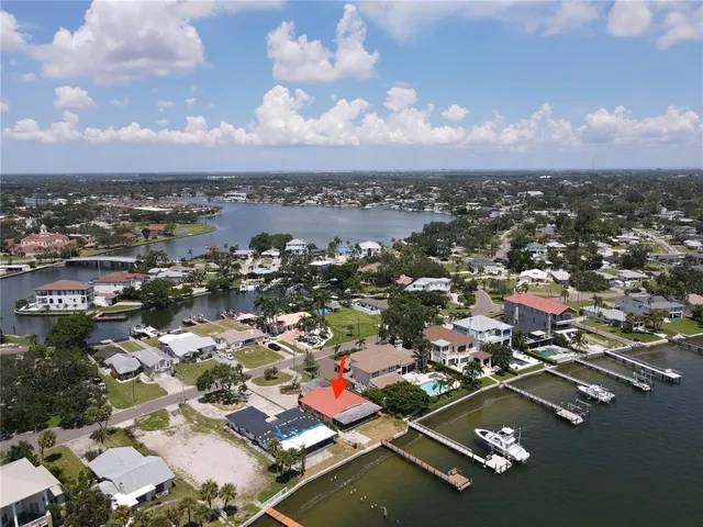 a aerial view of a house with yard and furniture