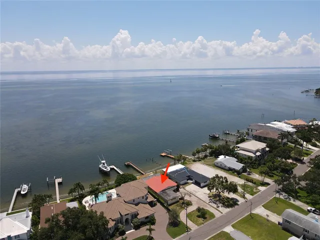 an aerial view of a city with ocean view