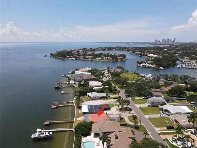 an aerial view of residential house with outdoor space and lake view