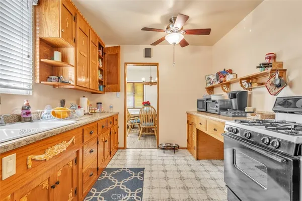 a kitchen with stainless steel appliances granite countertop a stove and a sink