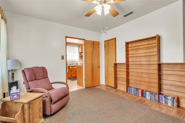a bedroom with furniture and a chandelier
