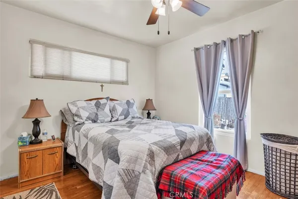 a bedroom with two beds and a chandelier