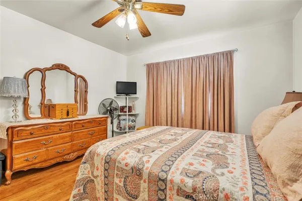 a bedroom with a bed and a large dresser