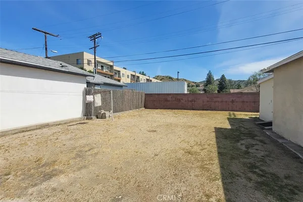 a view of a backyard of the house