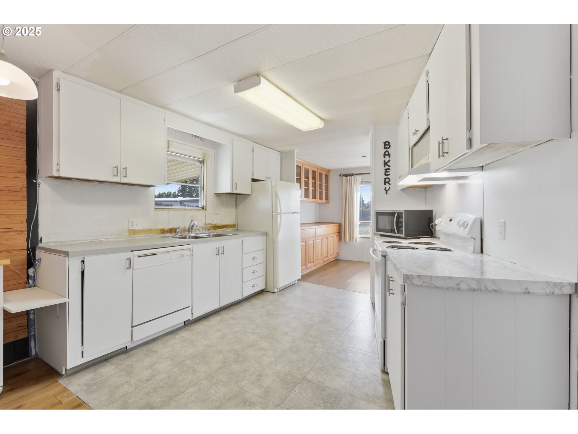 2902 East 2nd Street, Unit 67 Newberg, OR 97132 - Photo 11 of 38 a kitchen with cabinets and a sink