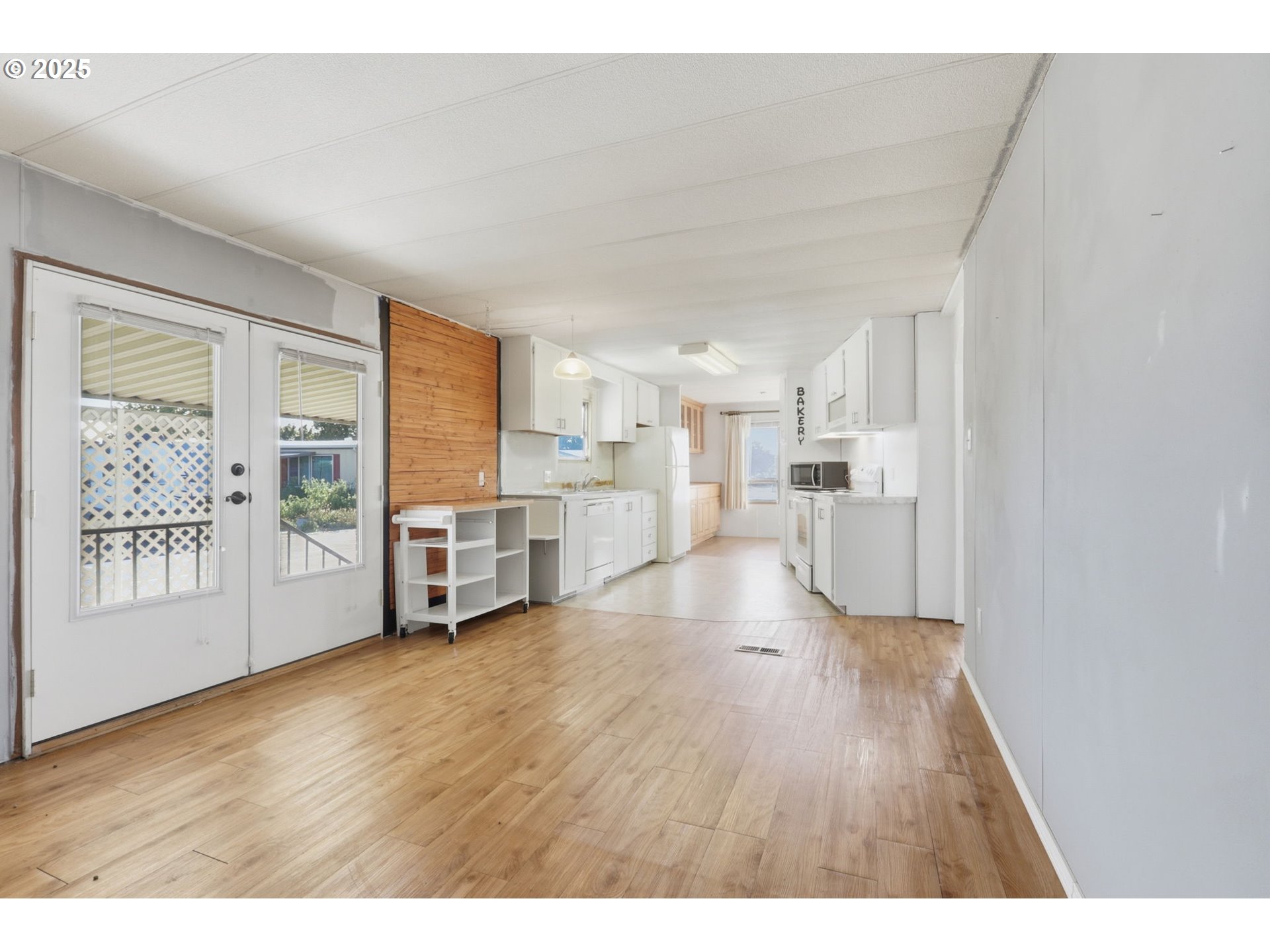 2902 East 2nd Street, Unit 67 Newberg, OR 97132 - Photo 17 of 38 a view of a kitchen with wooden floor