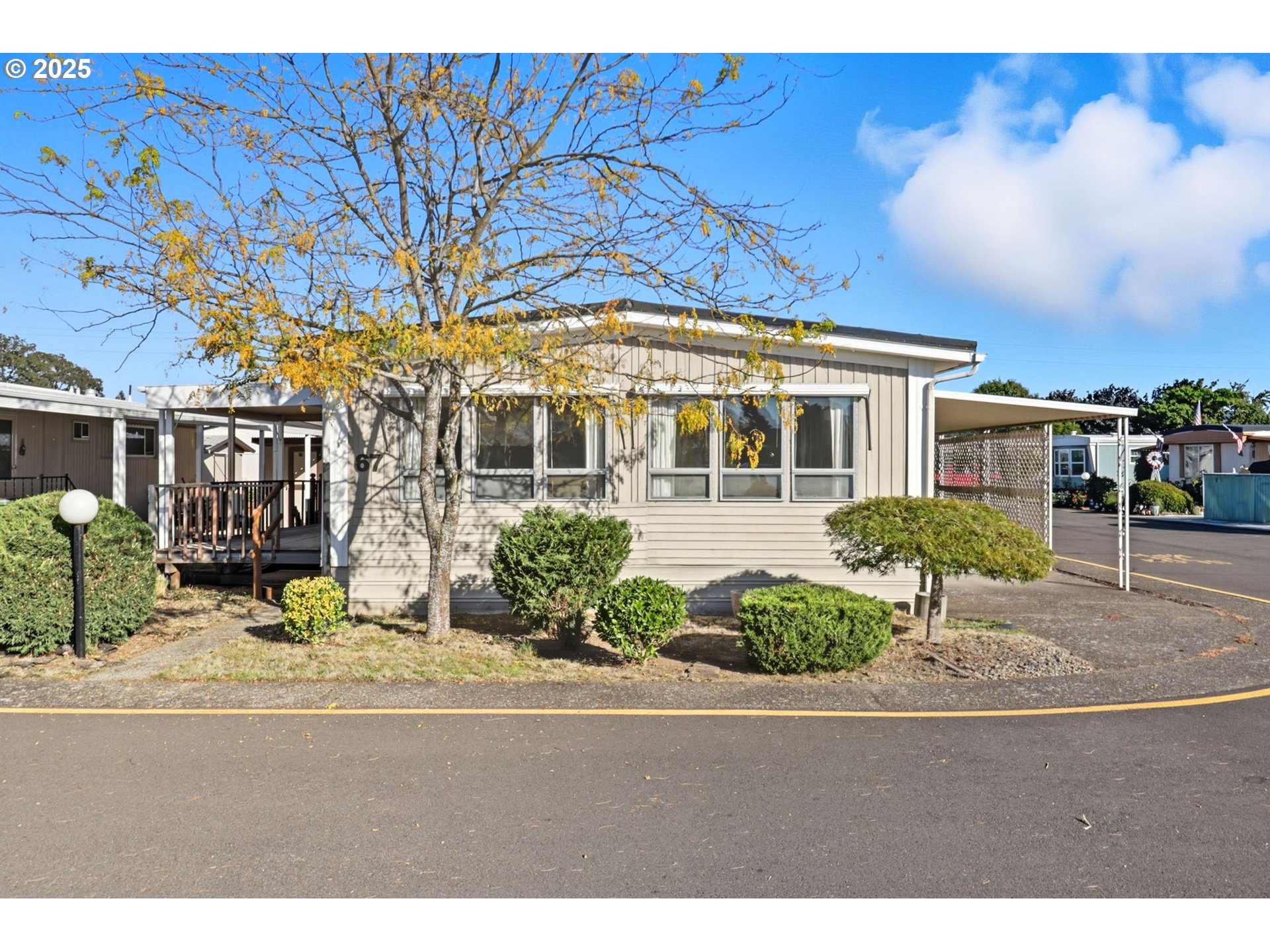 2902 East 2nd Street, Unit 67 Newberg, OR 97132 - Photo 2 of 38 a view of a building with a yard