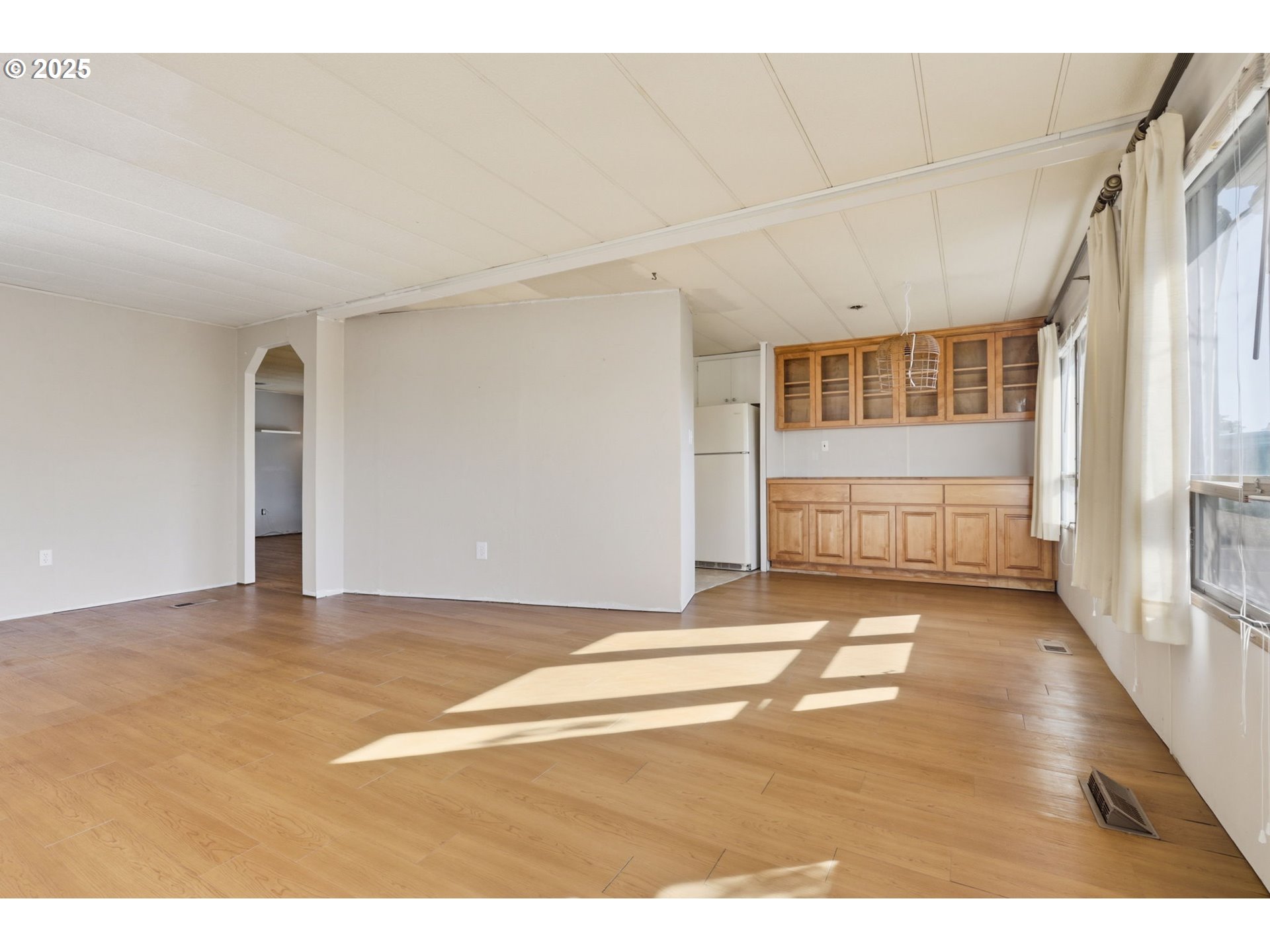 2902 East 2nd Street, Unit 67 Newberg, OR 97132 - Photo 8 of 38 a view of an empty room with wooden floor