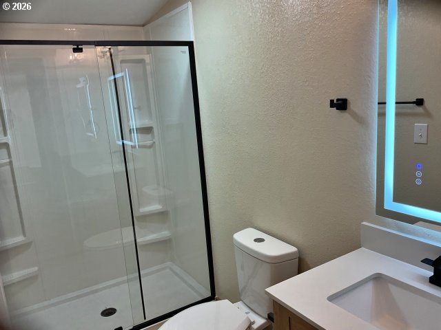 591 Southeast Carroll Street Winston, OR 97496 - Photo 13 of 21 a bathroom with a sink a toilet and shower