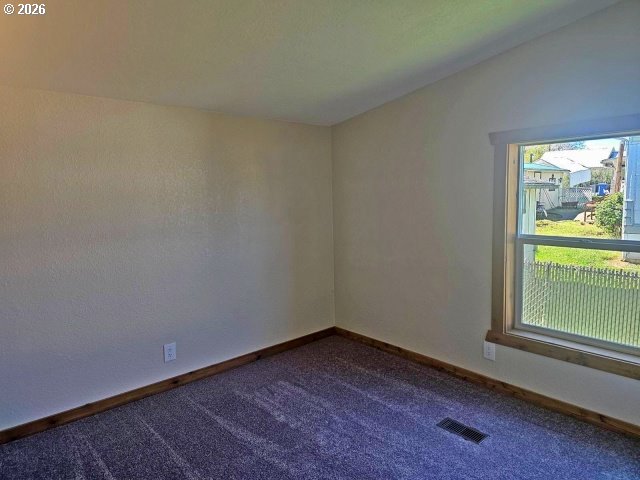591 Southeast Carroll Street Winston, OR 97496 - Photo 15 of 21 a view of empty room with window