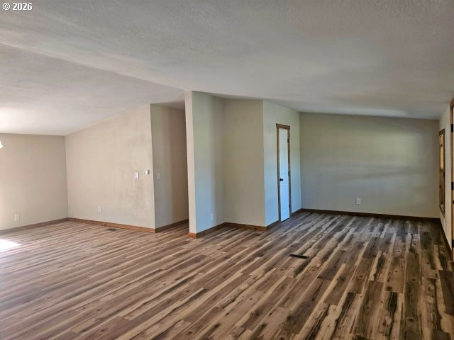 591 Southeast Carroll Street Winston, OR 97496 - Photo 17 of 21 a view of a room with wooden floor