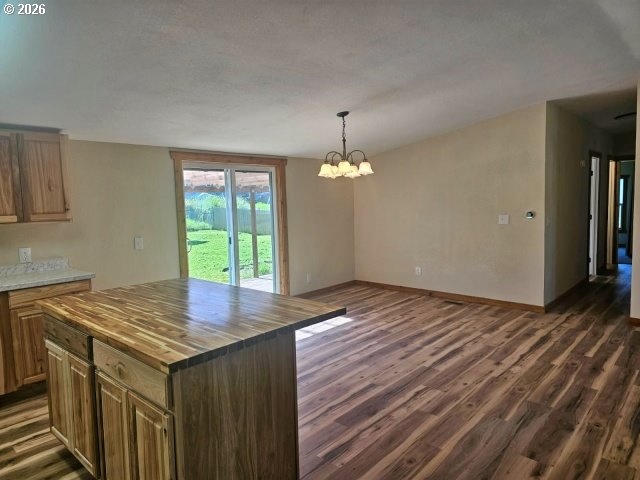 591 Southeast Carroll Street Winston, OR 97496 - Photo 18 of 21 a view of kitchen and wooden floor