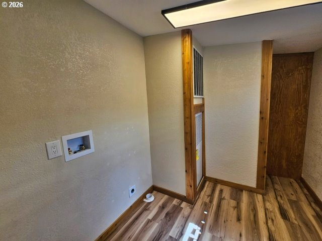 591 Southeast Carroll Street Winston, OR 97496 - Photo 19 of 21 a view of room with wooden floor