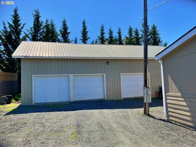591 Southeast Carroll Street Winston, OR 97496 - Photo 2 of 21 a front view of a house with a garden