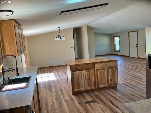 591 Southeast Carroll Street Winston, OR 97496 - Photo 5 of 21 a view of a hallway with wooden floor and staircase