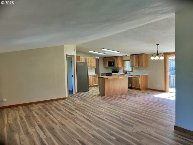 591 Southeast Carroll Street Winston, OR 97496 - Photo 7 of 21 a view of kitchen with wooden floor