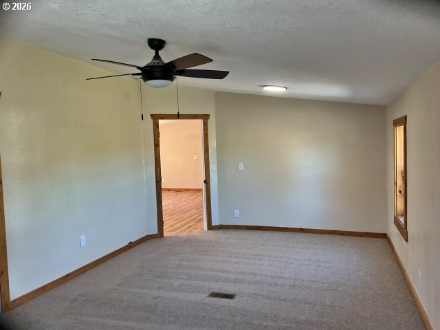 591 Southeast Carroll Street Winston, OR 97496 - Photo 9 of 21 a view of room with a window and a ceiling fan