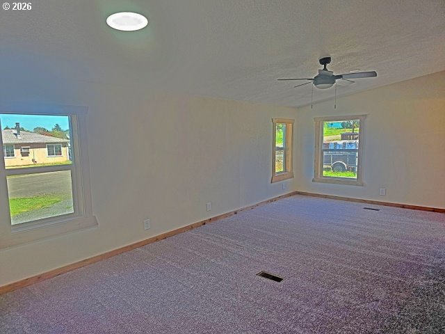 591 Southeast Carroll Street Winston, OR 97496 - Photo 10 of 21 an empty room that has windows