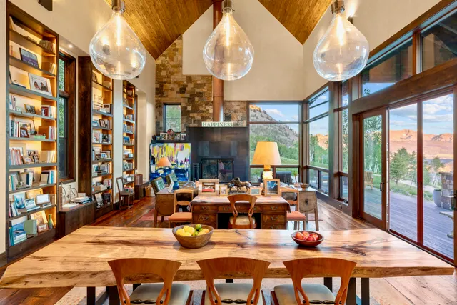 a room with lots of books and a book shelf