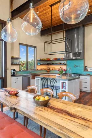 a living room with a large window and a table
