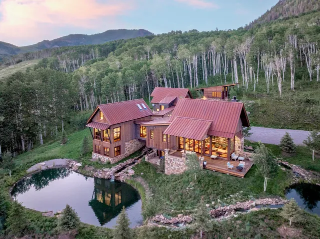 a living room with a flat screen tv and a large window