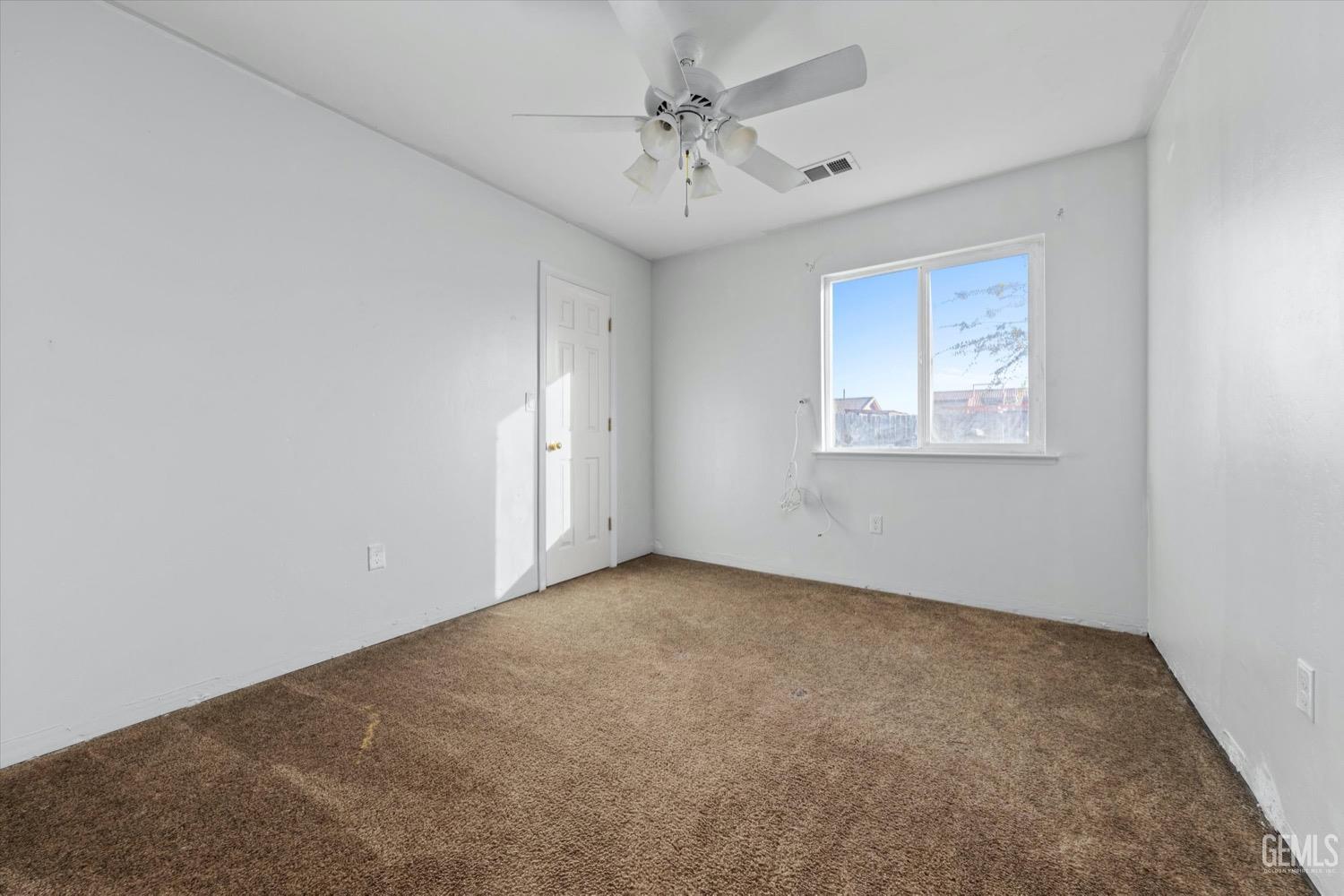 Undisclosed Address Shafter, CA 93263 - Photo 24 of 30 an empty room with windows and fan