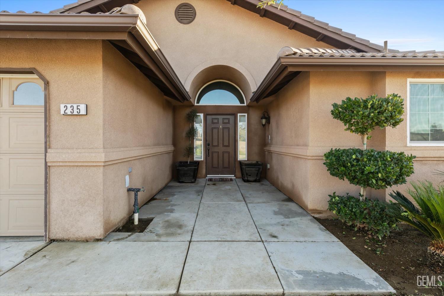 Undisclosed Address Shafter, CA 93263 - Photo 5 of 30 a house view with a garden